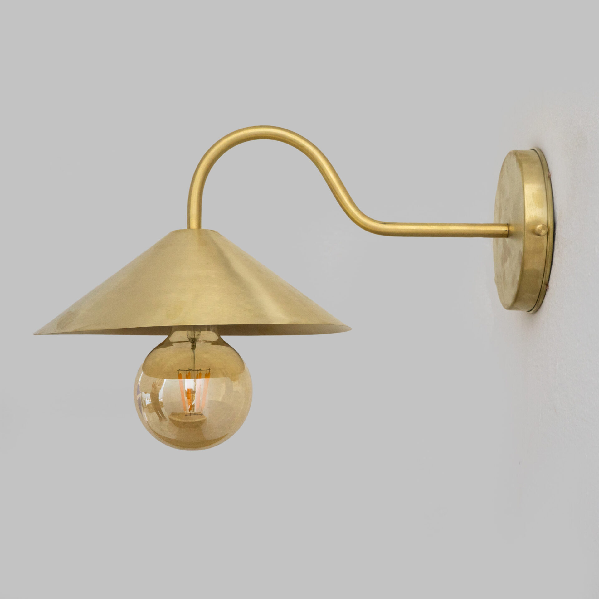 ✔ Solid Brass Construction: Combines durability and timeless beauty. ✔ Brushed Brass Finish: more subtle matte look, resistant to visible wear and scratches compared to high-shine finishes. ✔ E27 Base Compatibility: Compatible with any E27 base (bulb not included). ✔ Customizable: Size and shape can be customized upon request to fit your space and design vision. ✔ Space-saving: Provides an excellent alternative without the risk of tipping over or taking up valuable space. ✔ Easy Installation: Comes with concealed wall bracket, which requires minimal effort for installation.